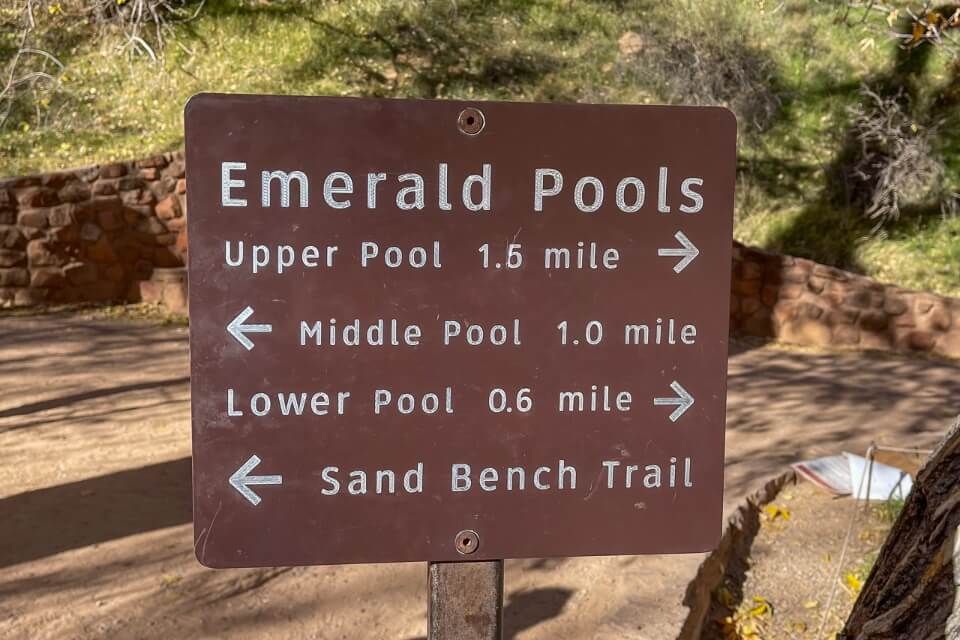 Distances to upper middle and lower emerald pools on a hiking trail in zion national park
