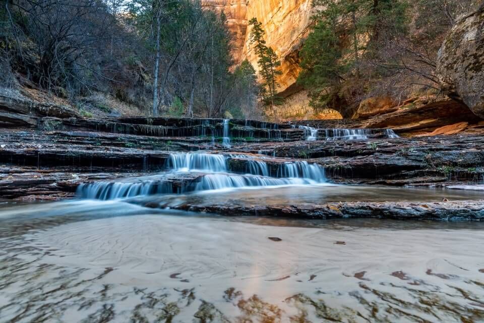 Archangel Falls is the stunning waterfall you pass on the way to The Subway in Zion sandy floor shallow water and multiple falls
