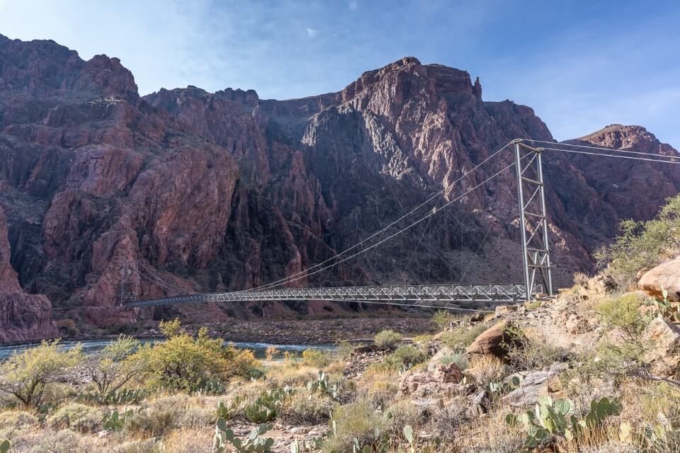 Crossing Bright Angel Bridge after hiking down South kaibab trail day hike grand canyon