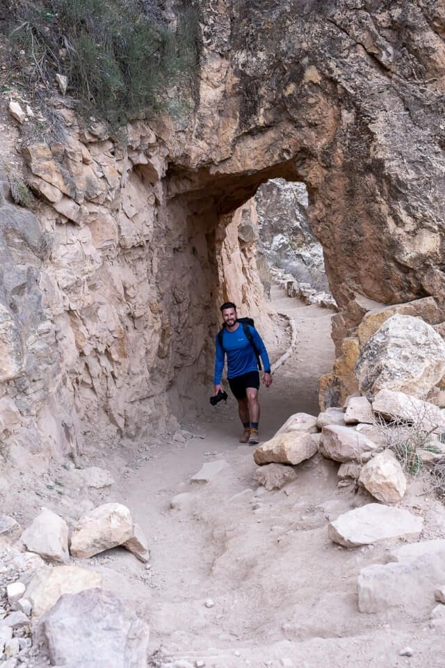 Walking through a tunnel on a hike in arizona