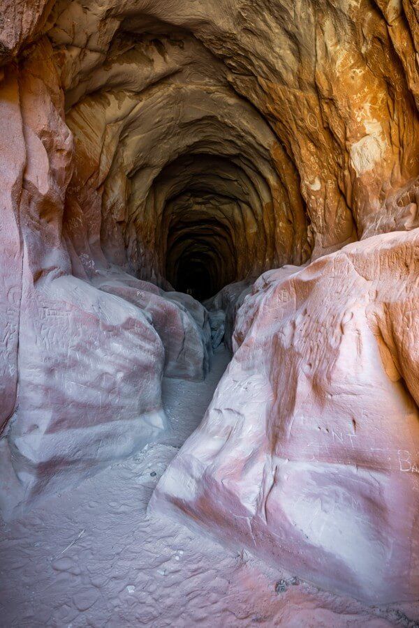 Hiking through belly of the dragon tunnel in kanab utah