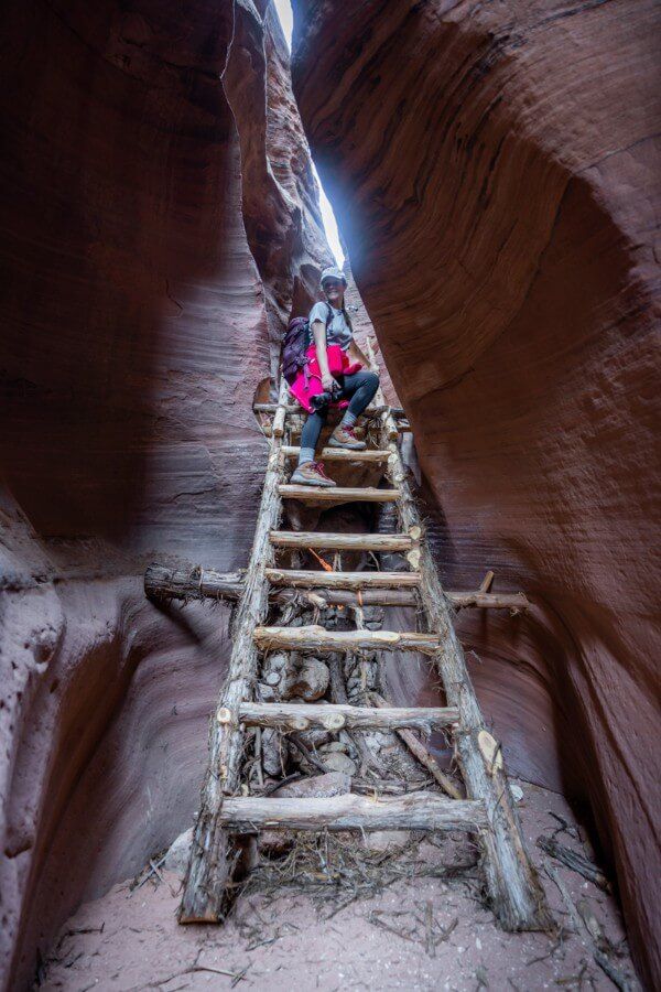 Climbing a ladder inside Buckskin Gulch slot canyon near Wire Pass Utah