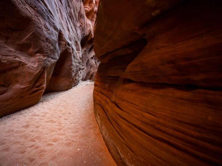 Buckskin Gulch day hike from Wire Pass trailhead sandy trail through longest slot canyon in the United States narrow canyon walls orange sandstone