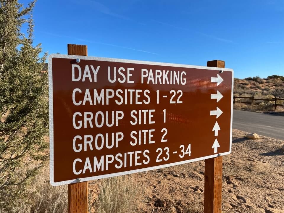 Camping sign with direction to sites