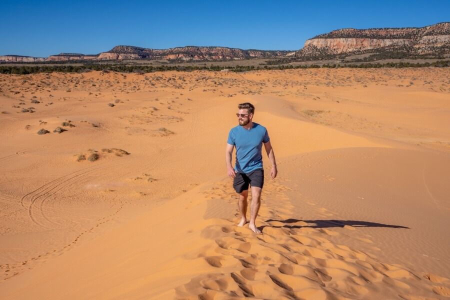 Hiking sand dunes on a glorious day at coral pink sand dunes state park in Kanab Utah