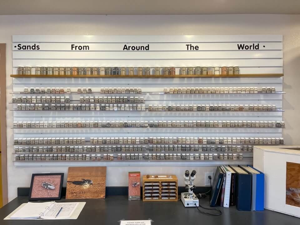 Visitor center with sands from around the world in bottles on a shelf