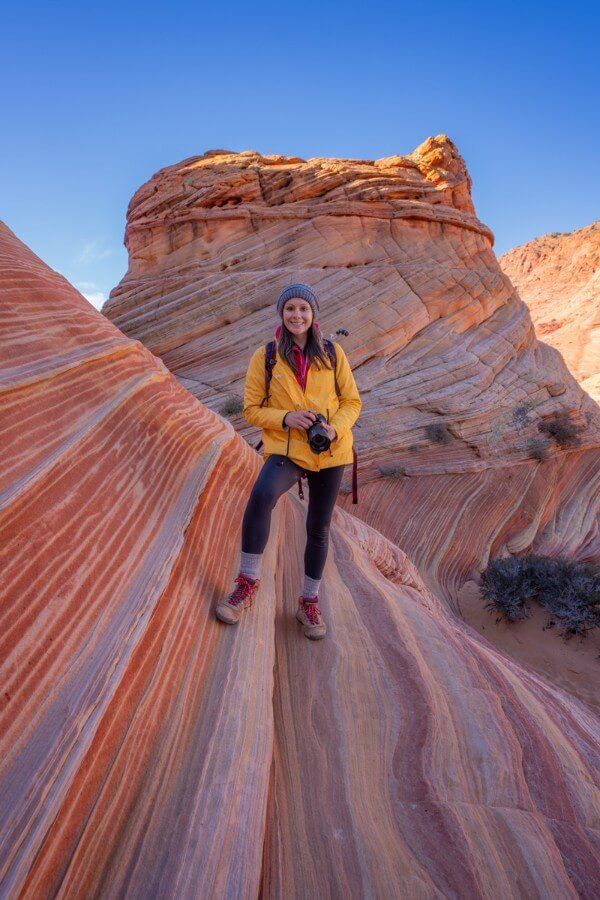 Hiking photographer smiling for a photo at The Second Wave in Arizona