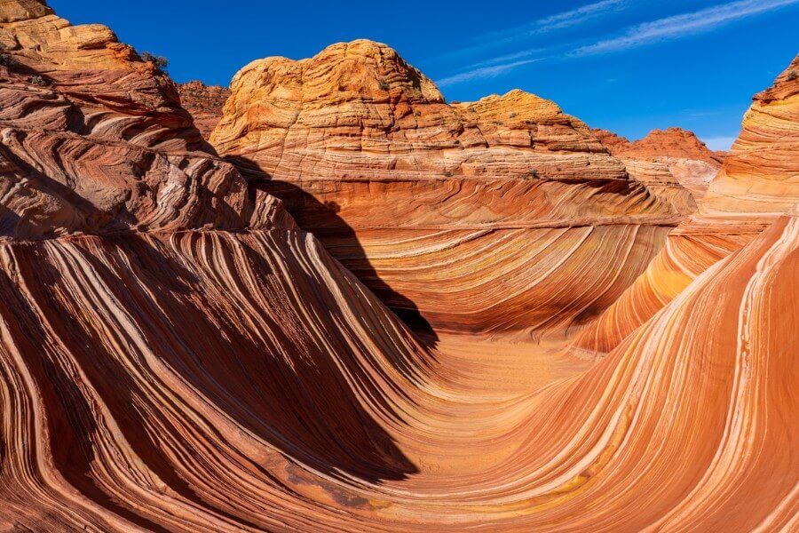 Hiking The Wave to an iconic photography location in northen arizona with U shaped sand layers forming a unique landscape