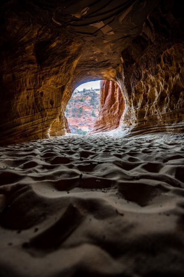 Deep dunes with orange rocks and sunlight