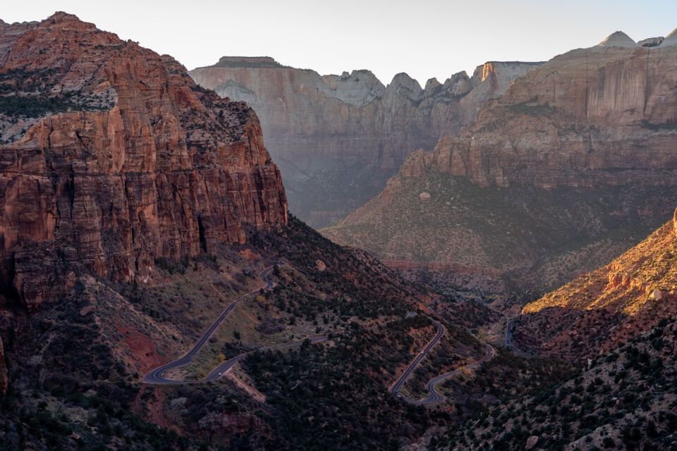 Stunning photo of switchbacks on the Zion Mt Carmel Highway at sunset in zion national park utah