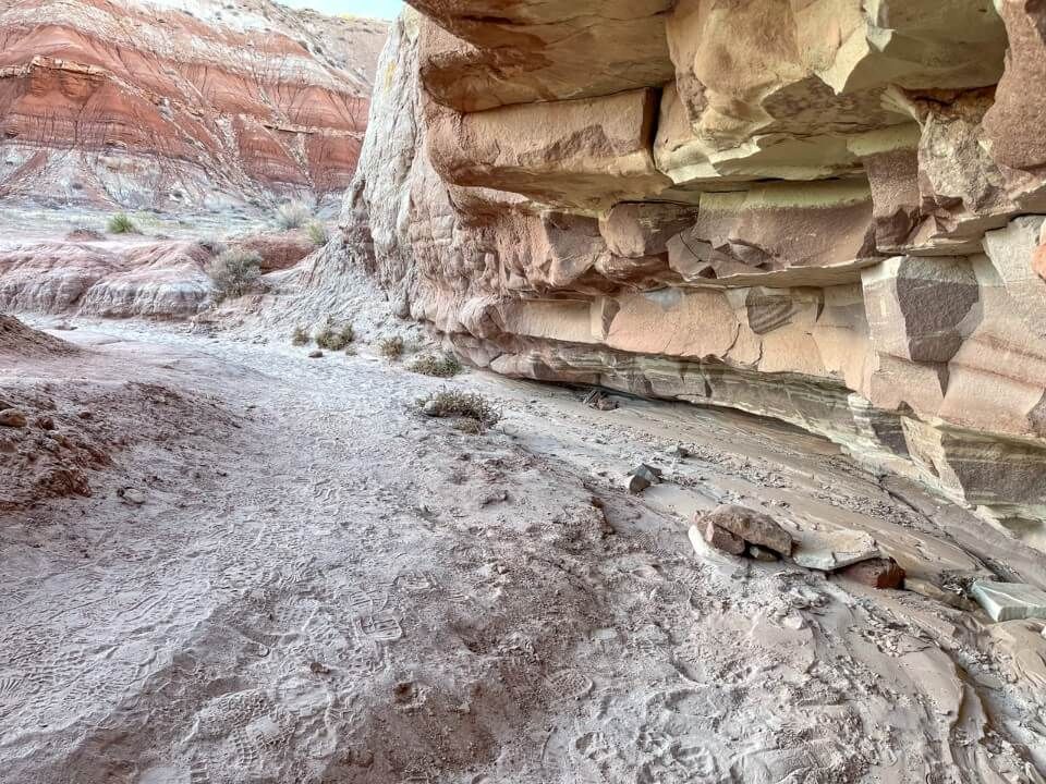 Dry river bed with eroded cliff to the right side