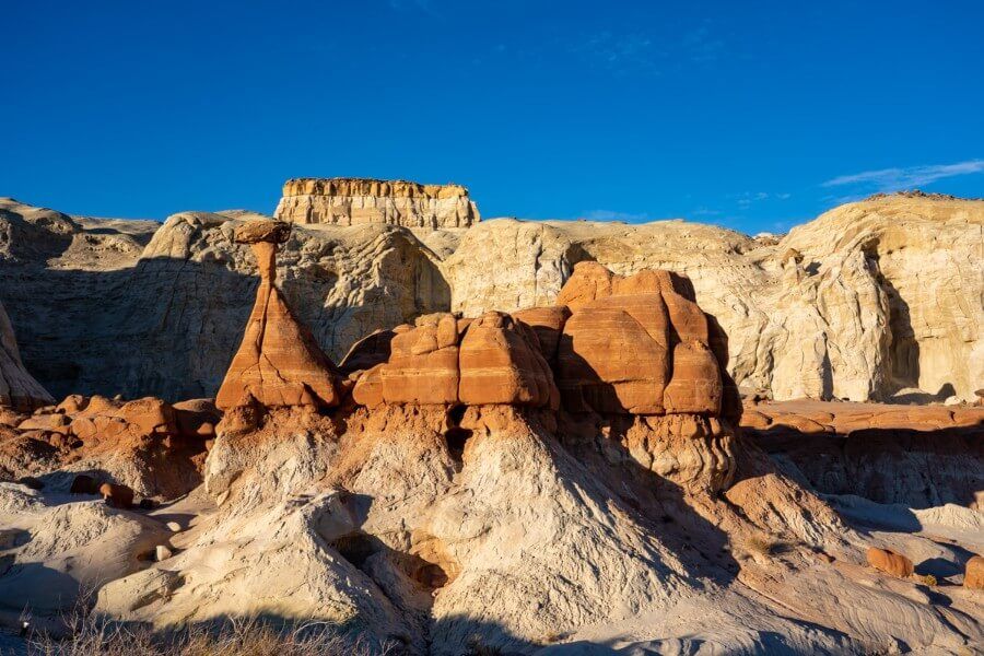 Sunset is the best time to hike toadstool hoodoos for excellent light golden yellow