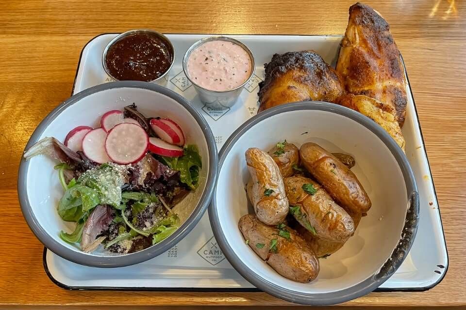 Eating out at Camp Outpost in Springdale Utah chicken potatoes and salad