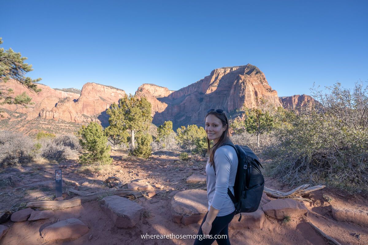 Hiker in light upper layer walking around Zion in December on a clear day