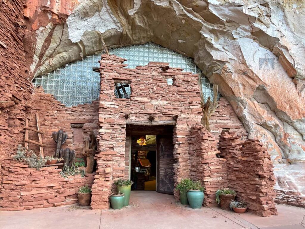 Moqui Cave museum brick entrance with glass panes covering cave entrance