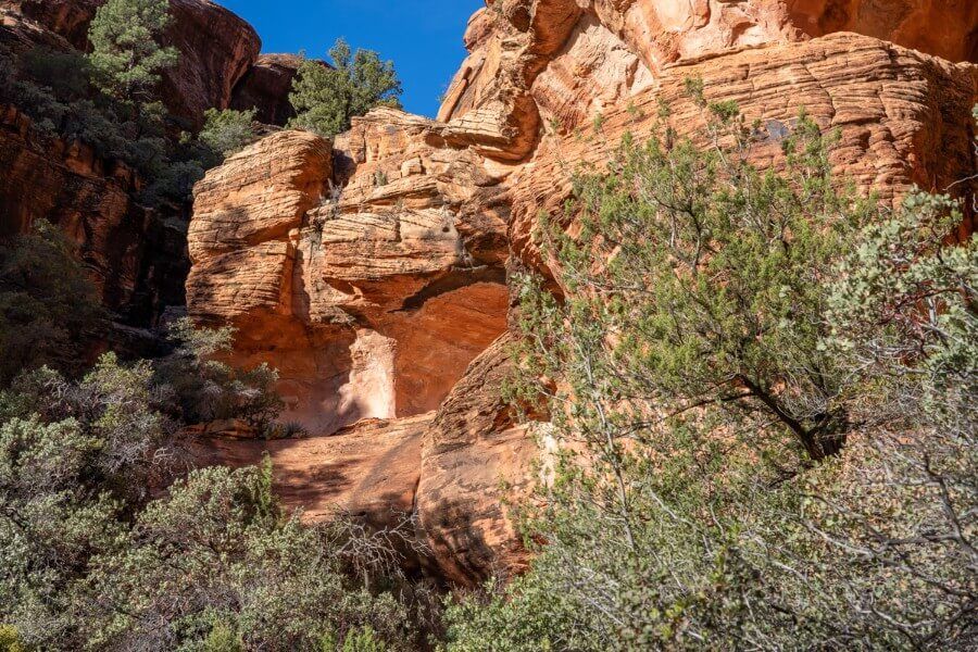 Red rock formation glowing under sunlight