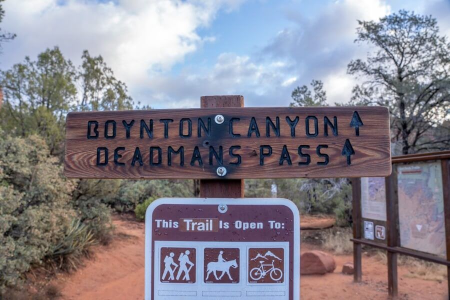 Deadmans Pass sign marker with direction