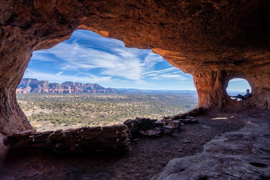 One large window and one small window with hiker sat inside