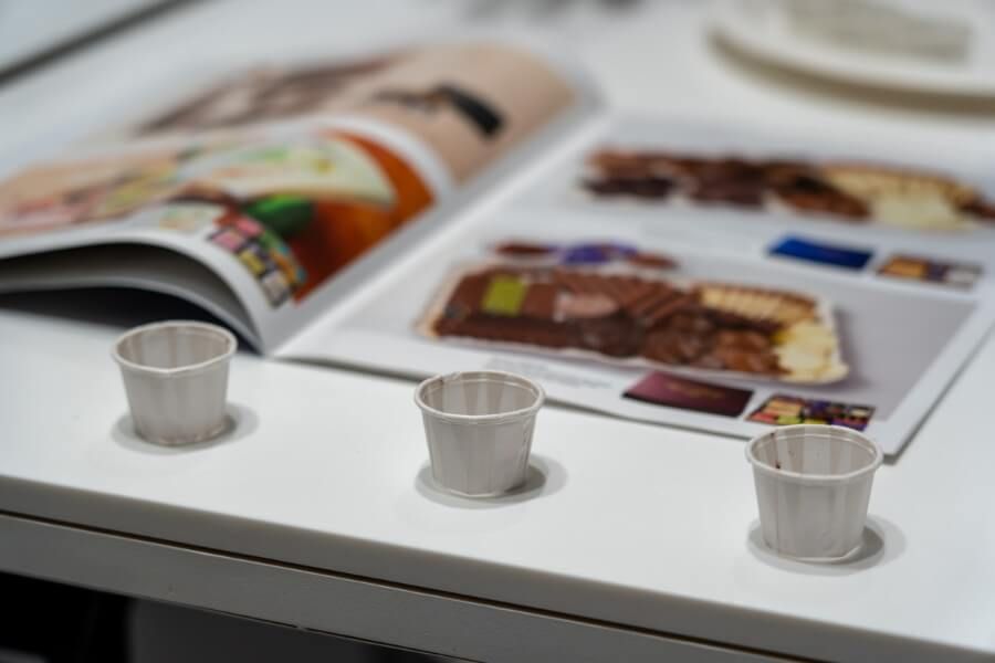 Nama chocolate sample in small white cups