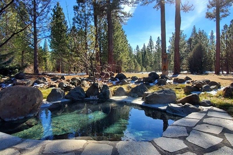 An outdoor hot spring pool at  Sierra Hot Springs Resort in Calirofnia