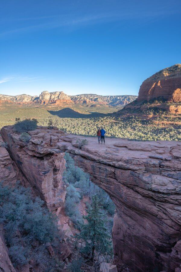 Couple standing on Devils Bridge for the classic photo
