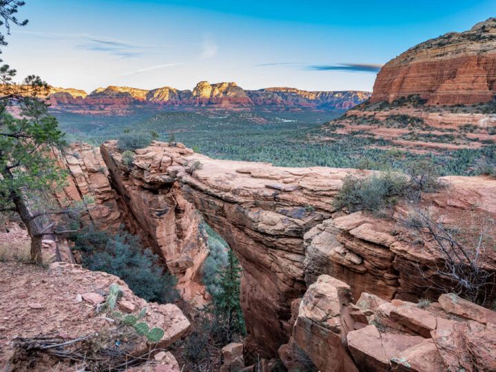 Devils Bridge Trail Hike in Sedona Arizona at sunrise is one of the most popular photography spots in Sedona naturally formed sandstone arch with far reaching views