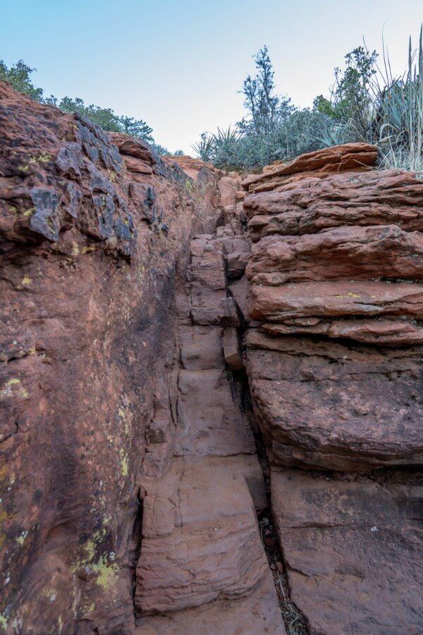 Eroded rocks forming a narrow gulley on a hike in arizona