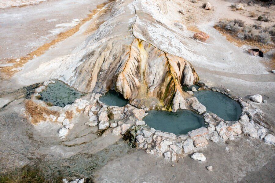 A drone photo from above of travertine hot springs