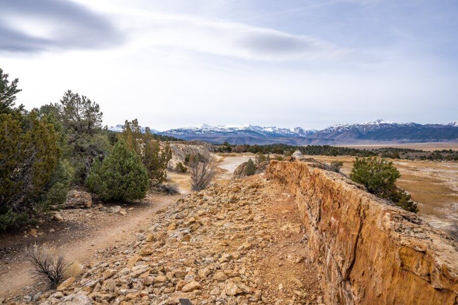 The view from the top of a travertine terrace with mountains in the distance