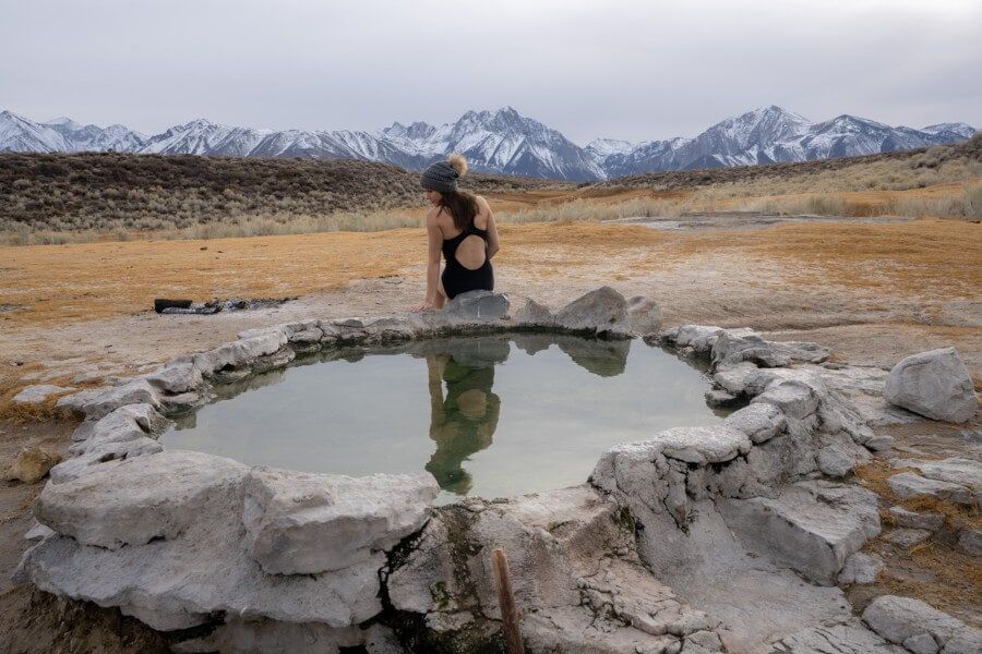 Woman enjoying a hot spring pool in mammoth lakes california