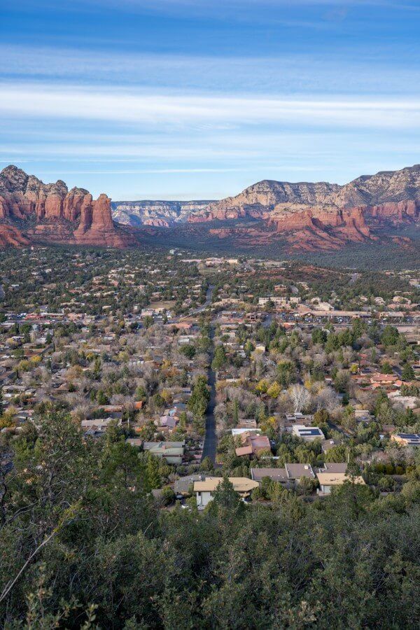 City surrounded by red rocks and green vegetation in Northern Arizona