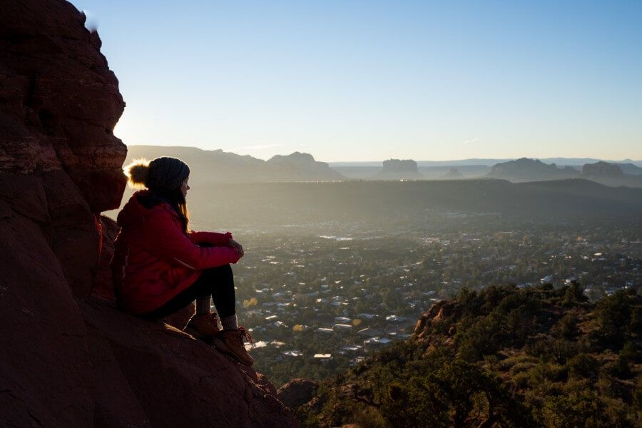 Hike watching sunrise from a rock under sunlight in northern arizona