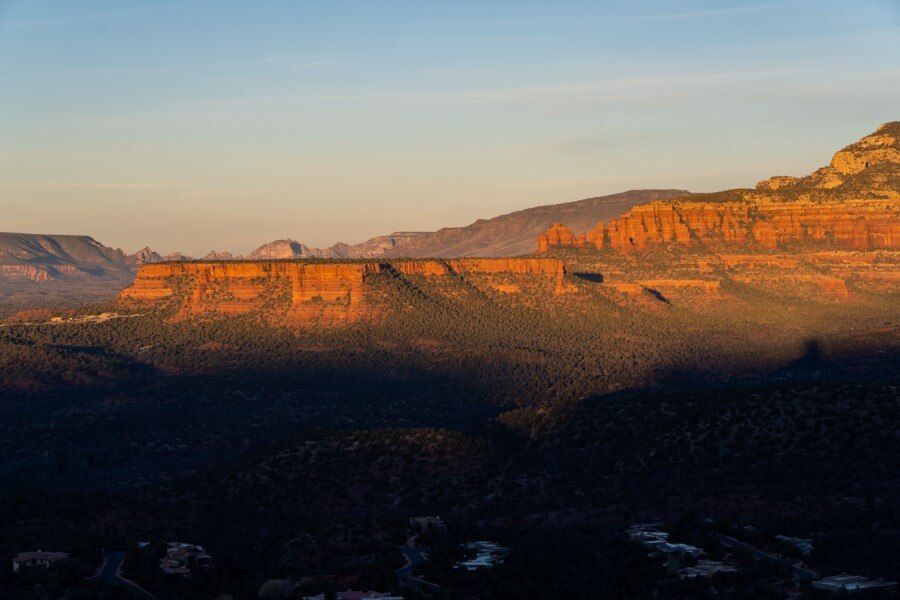 Stunning sunrise soft light colors glowing over Sedona from Chimney Rock and Little Sugarloaf hiking trail