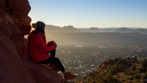 Where Are Those Morgans hiking to Chimney Rock summit for a stunning sunrise over Sedona in Arizona dawn light filling a wide open landscape on the Little Sugarloaf loop trail