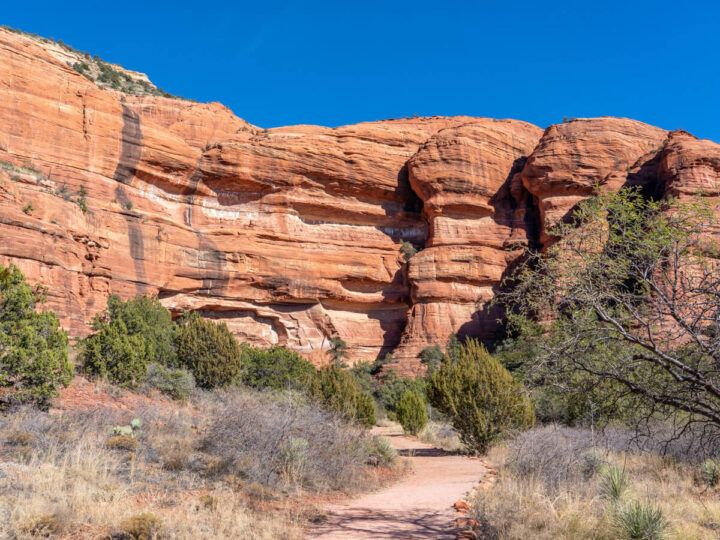 A hiking trail leading to an ancient cliff dwelling