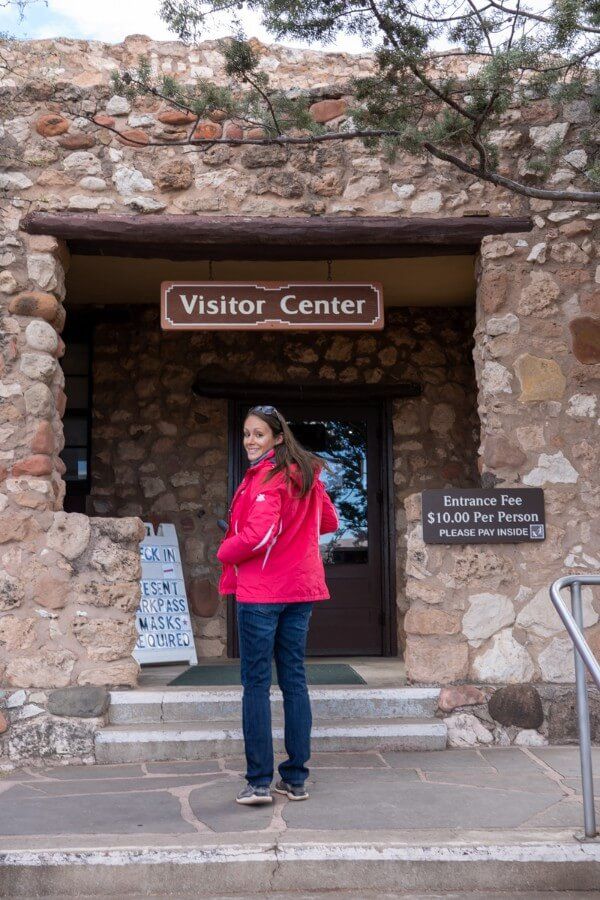 A woman walking into the Visitor Center at Tuzigoot