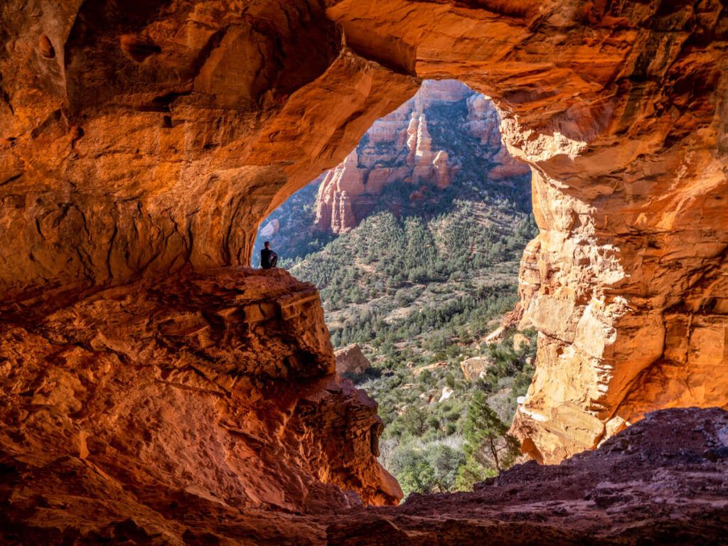 Keyhole Cave one of the best cave hikes in Sedona hiker perspective against enormous entrance