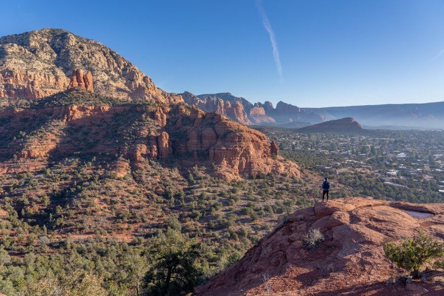 Hiker enjoying the view from the summit of Little Sugarloaf in Arizona