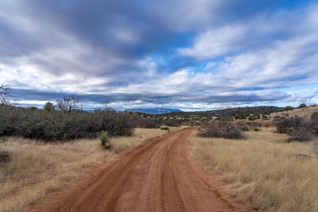 Dirt road and cloudy sky in rural arizona