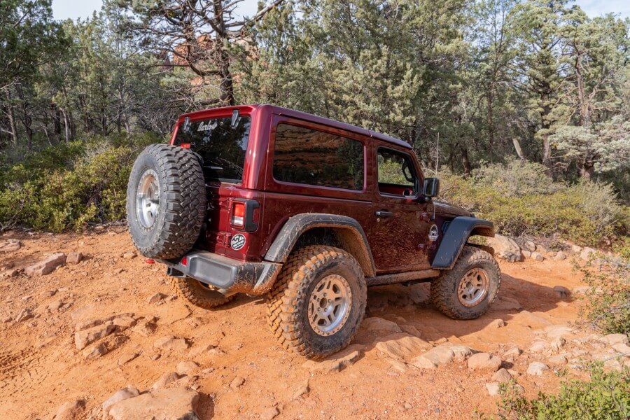 Driving down a rocky road in a Rubicon Soldier Pass OHV