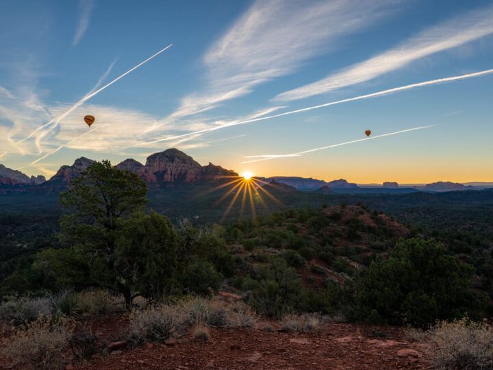Spectacular sunrise from Mystic Vista one of the best and most unknown sunrise and sunset photography locations in Sedona Arizona hot air balloons taking off at dawn