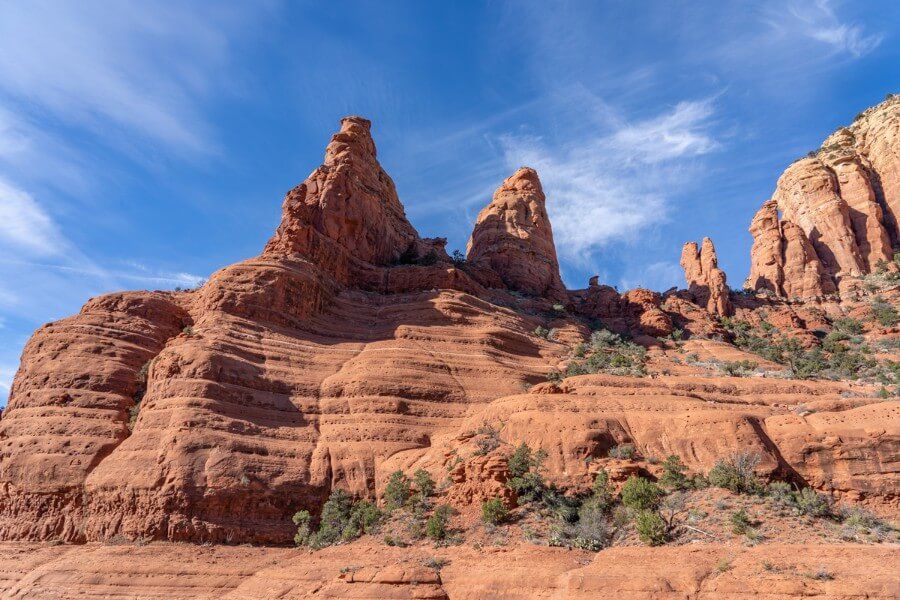 Red rock formations at Chicken Point vista with mountain bike track running along a high contour