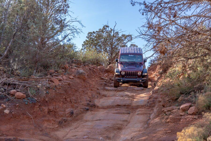 Rubicon with a huge tilt dropping down steep rock stairs