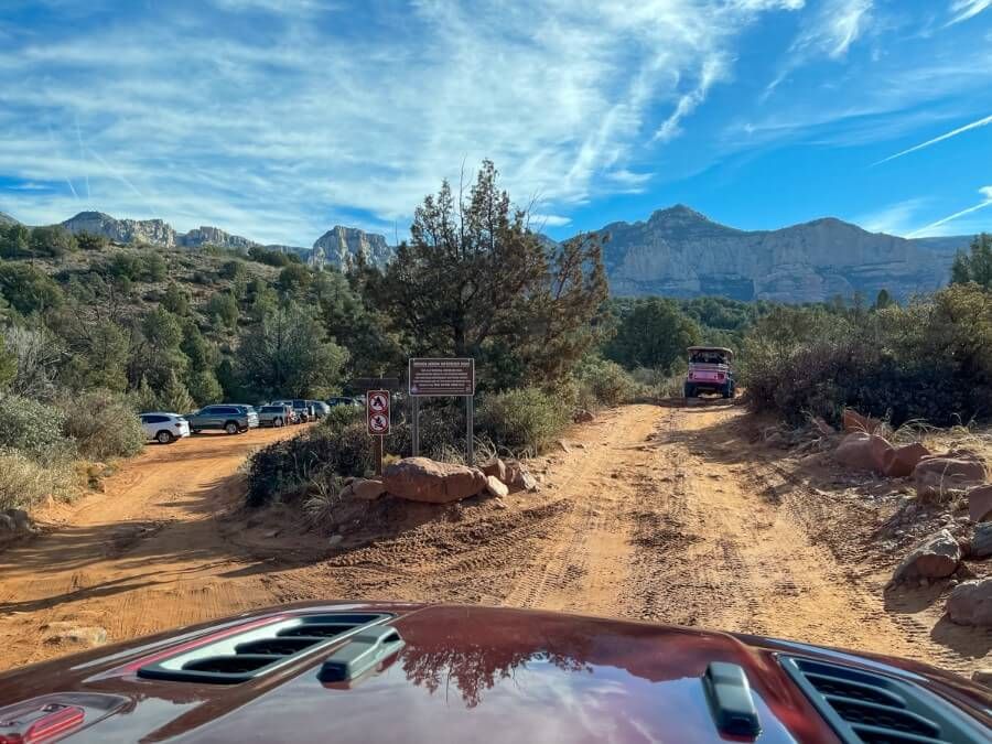 Photo through windshield of wrangler entering a 4WD road 