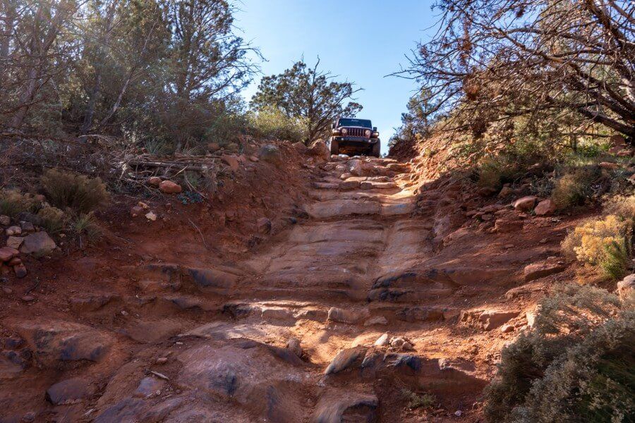 Jeep Rubicon at the top of the stairs section of Broken Arrow trail in Sedona Arizona