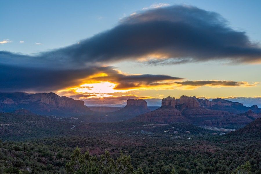 Dramatic sunrise over Sedona from secret photography location on Red Rock Loop road