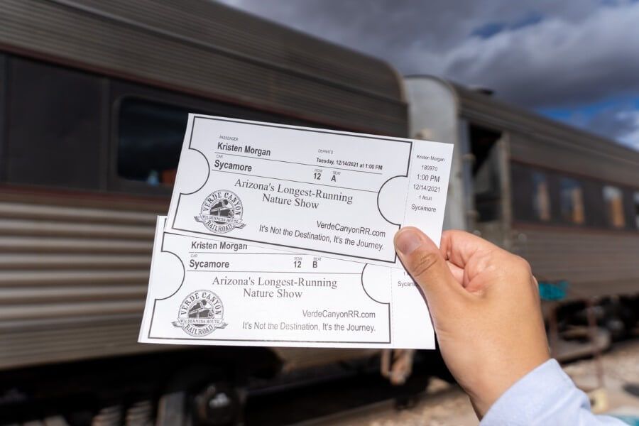 Woman holding two tickets for the Verde Canyon Railway