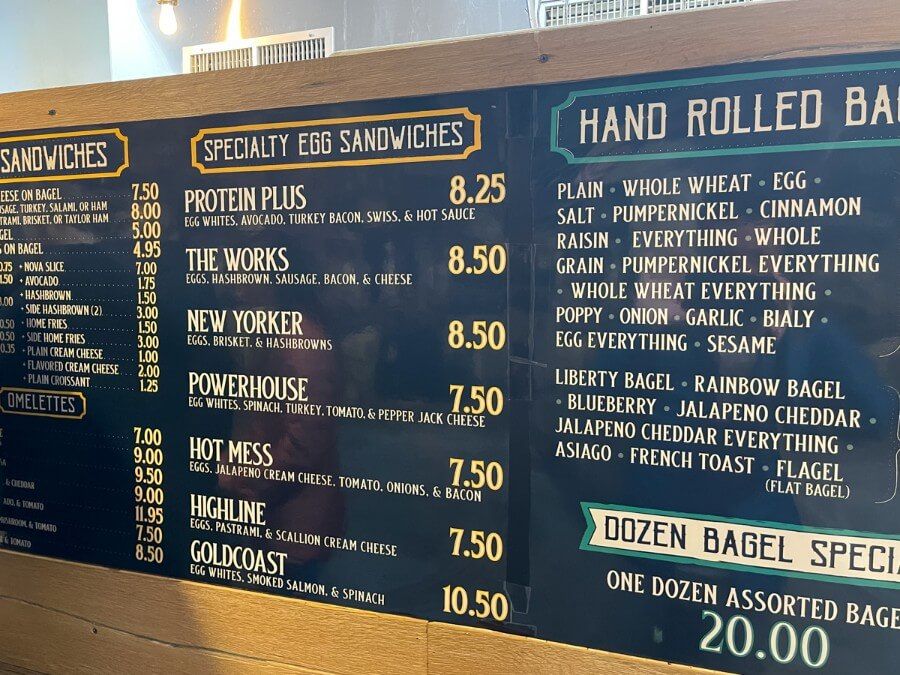 A menu of speciality egg sandwiches and hand rolled bagels
