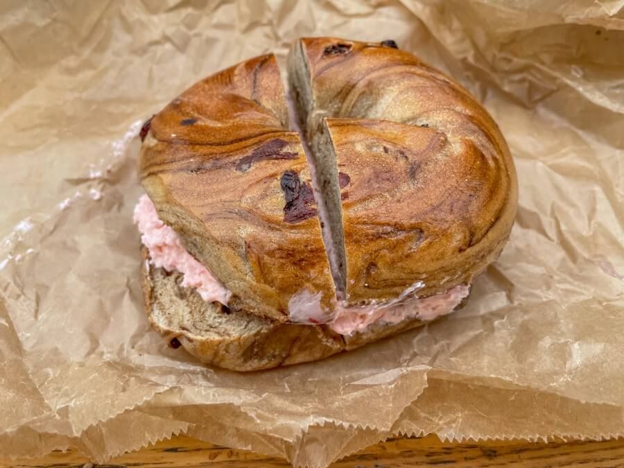 Cinnamon raisin bagel with strawberry cream cheese in NYC
