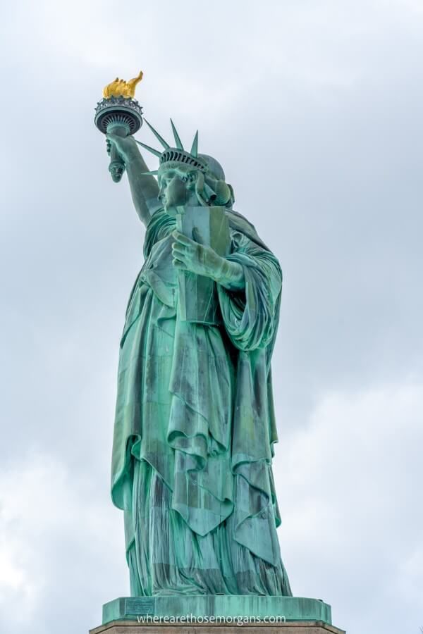 Statue of Liberty close up photo on a cloudy day